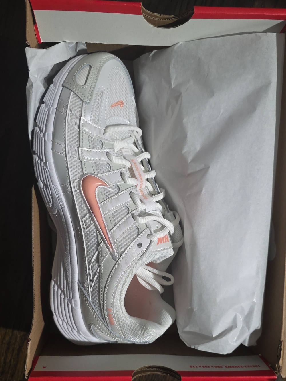 Nike Women's White Sneakers with Peach Accent